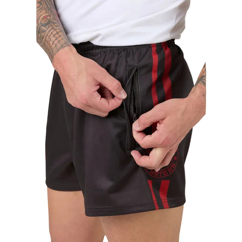 Person wearing charcoal grey shorts with red stripes, using zip on the side pocket against a white background