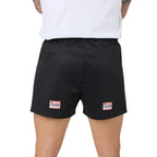 Black shorts with brand logos on a white background