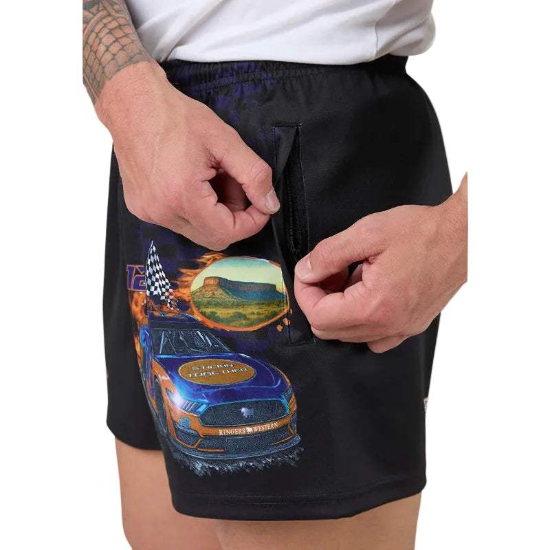 Black shorts with a colorful car design on a plain background
