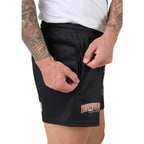 Person wearing black shorts with 'Ringers Racing' logo on a plain background