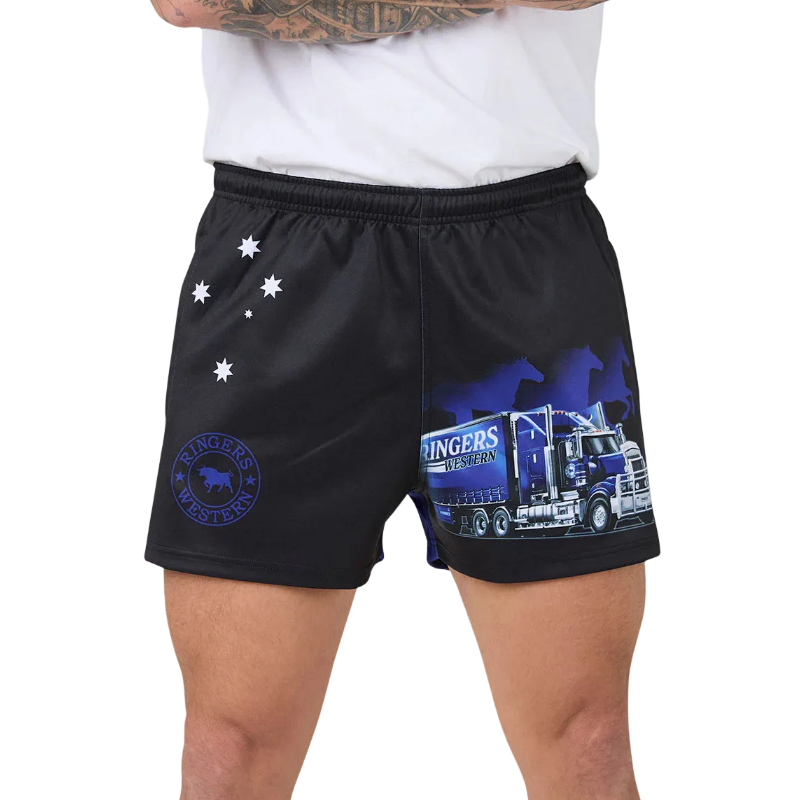Black footy shorts with a blue and white semi-truck graphic and white star details, shown on a model wearing a white t-shirt against a white background.