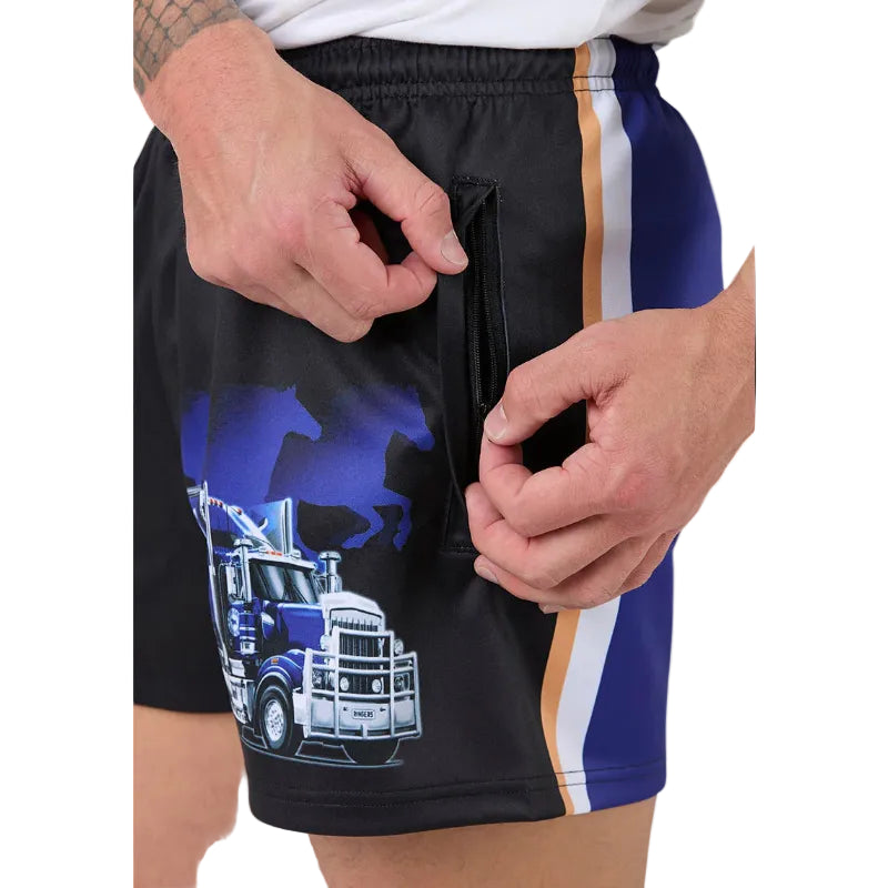 Close-up of a person wearing black footy shorts with a blue and white semi-truck graphic, a blue horse silhouette, and a vertical blue, white, and gold stripe on the side. The person's hands are shown zipping a side pocket.
