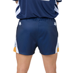 Navy footy shorts with white accents on a plain background