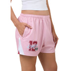 Pink shorts with a number 12 design on a plain background