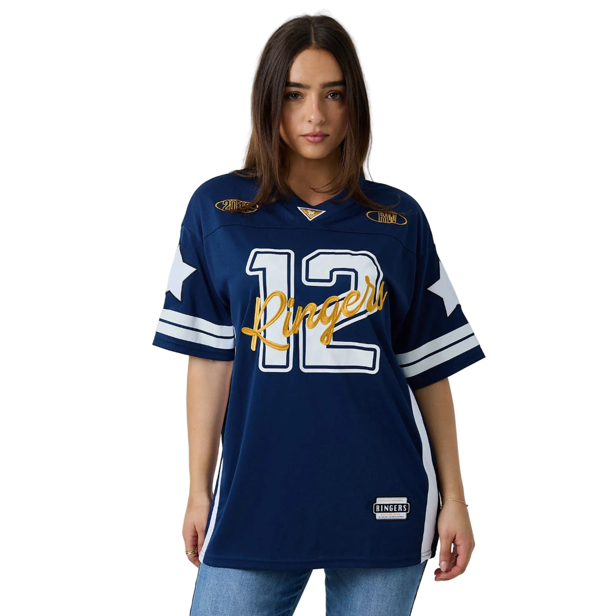 A woman modeling a navy blue short-sleeve sports jersey with white and gold accents. The jersey features the number 12 on the front, 'Ringers' written in gold script across the chest, and sleeve stripes.