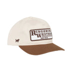 A cream-colored baseball cap with a brown visor and a front patch reading 'Ringers Western Road House' with a small brown logo on the side, set against a white background.