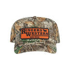 A camouflage baseball cap featuring a prominent orange rectangular patch on the front with the text 'Ringers Western Road House' in black.