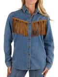 A woman wearing a blue denim western-style button-up shirt with large brown fringe panels across the chest, paired with blue jeans against a plain white background.
