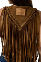 Close-up back view of a person wearing a brown suede fringe vest with braided trim and a visible Ringers Western label at the neckline.
