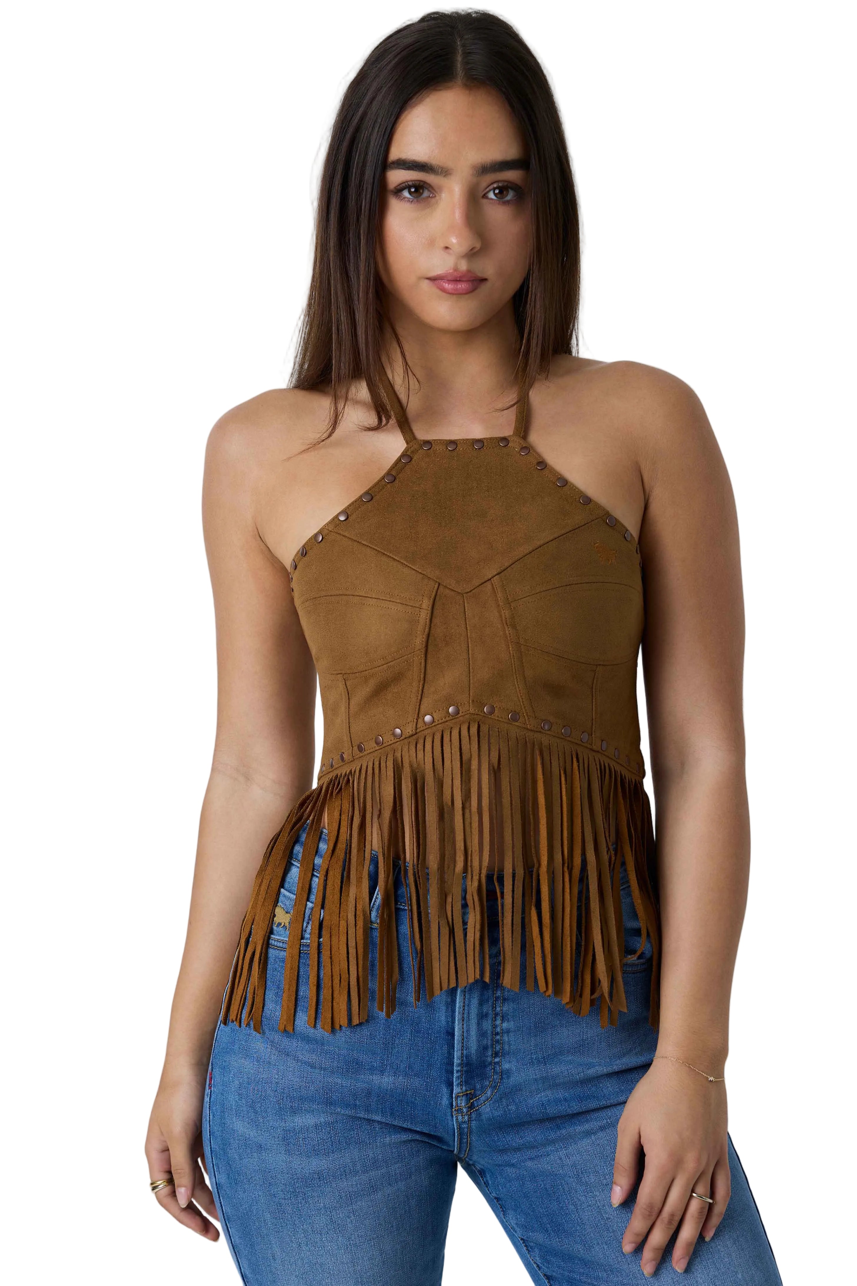 A woman modeling a brown suede halter top with fringe detailing, paired with blue jeans, against a white studio background.