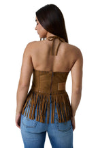 A woman shown from the back wearing a brown suede halter-style top with fringe trim and a zip closure, paired with blue jeans against a white studio background.