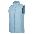 The Ritemate Womens Pilbara Vest (RMPC054) in Cerulean features a light blue, sleeveless quilted design with a high collar, front snap buttons, side pockets, and polyfill padding for warmth and comfort in cold weather.