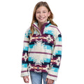 A smiling young girl with long light brown hair wears the Roper Girls L/S Pullover (29250706) Multi, featuring geometric shapes in blue, purple, and cream by Roper, paired with light blue jeans against a white background.