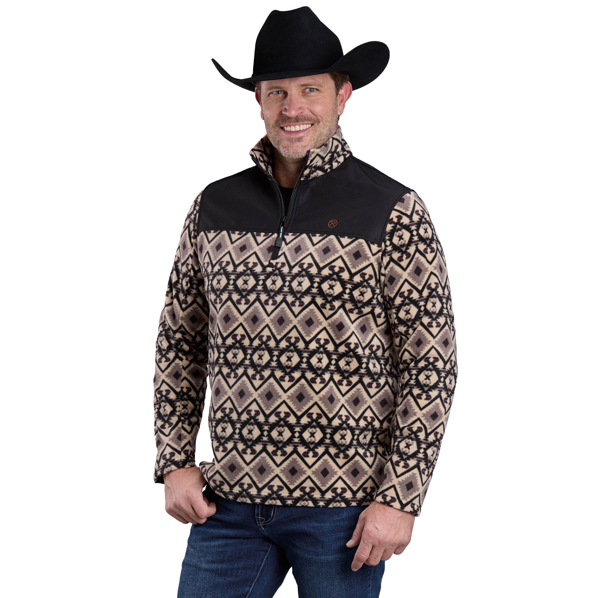 A smiling man in blue jeans and a black cowboy hat wears a Roper Mens L/S Pullover (97692210) Black, featuring beige and black geometric designs, standing with one hand in his pocket against a white background.