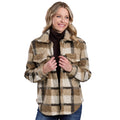 A blonde woman wears the Roper Women's L/S Shirt Jacket (98119125) in brown over a dark turtleneck and blue jeans, standing and smiling against a white background.