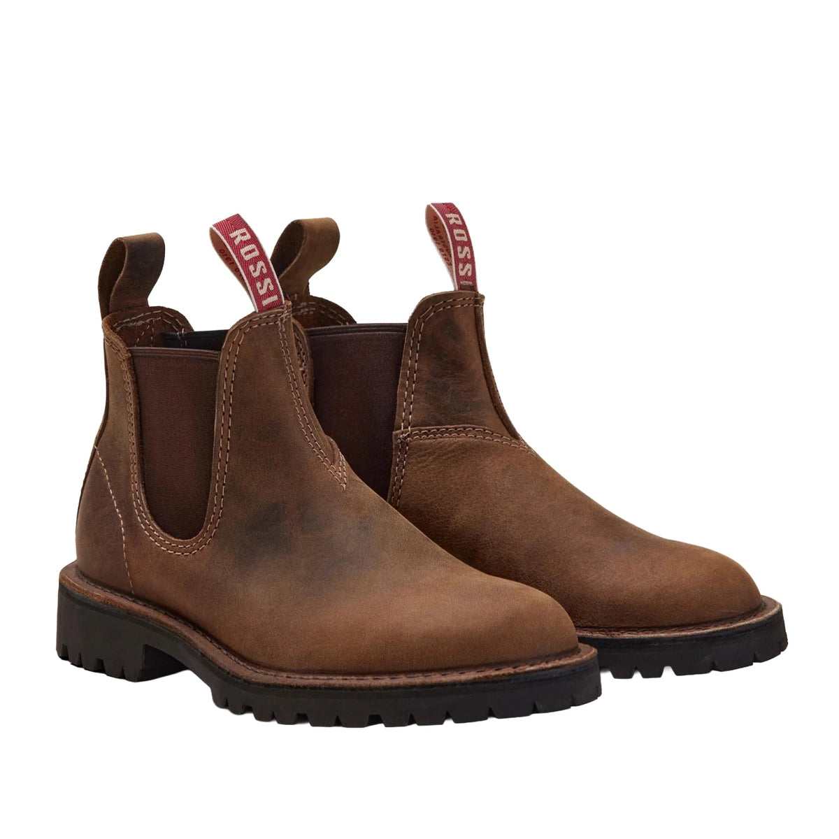 A pair of two tone tan leather Rossi Simpson Elastic Sided Boots (4003) with black rubber soles, shown from a three-quarters angle on a plain white background.