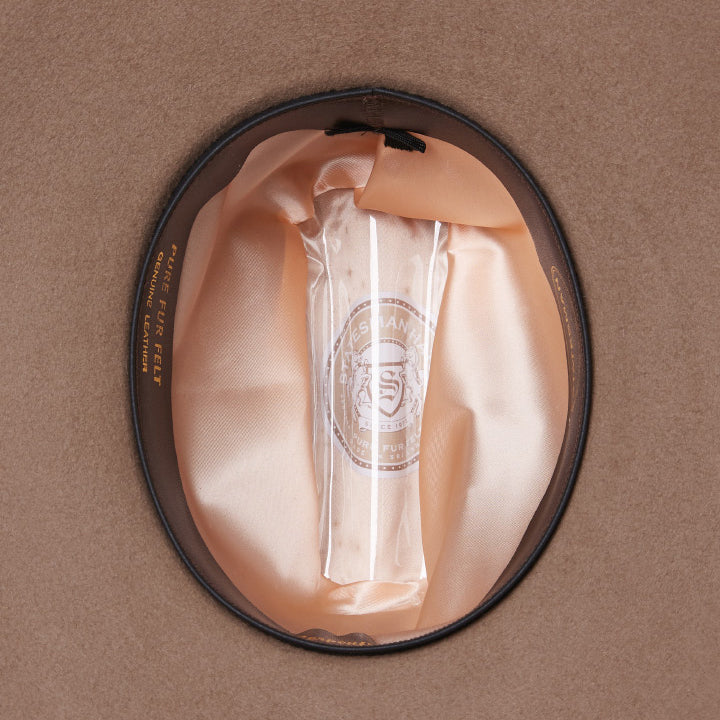 The inner of a sand Statesman Serpentine Fur Blend Hat (21050060) with an inner leather band and satin lining.