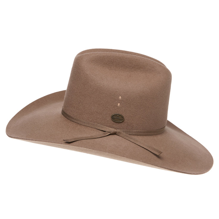 A side view of a sand Statesman Serpentine Fur Blend Hat (21050060) with a wide brim, a pinched crown, and a matching ribbon band, shown on a plain white background.