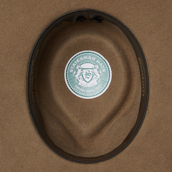 The inner of a wide-brimmed Statesman Big Australian Wool Felt Hat (S0116579) in the colour Riverstone, featuring a dark brown inner leather band.
