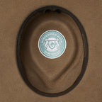 The inner of a wide-brimmed Statesman Big Australian Wool Felt Hat (S0116579) in the colour Riverstone, featuring a dark brown inner leather band.