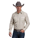 A man wears a Stetson Mens Collection L/S Shirt (01476012) in white, blue jeans, a large belt buckle, and a gray Stetson cowboy hat, standing forward with one hand on his belt.