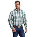 A man wearing a Stetson Mens Collection L/S Shirt (01579003) Plaid Blue stands with one hand in his pocket, paired with blue jeans and a large belt buckle, against a plain white background.