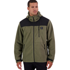 A man stands against a white background, wearing the Swanndri Men's High Rock Stormshield Jacket (SW2562070M) in Forest, an olive green weatherproof fleece with black front yoke