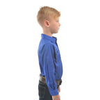 A young boy in profile modelling a cobalt blue Thomas Cook Children's Heavy Drill Half Button Long Sleeve Shirt (TCP7100163) with two chest pockets, paired with dark jeans and a brown belt, on a white background.