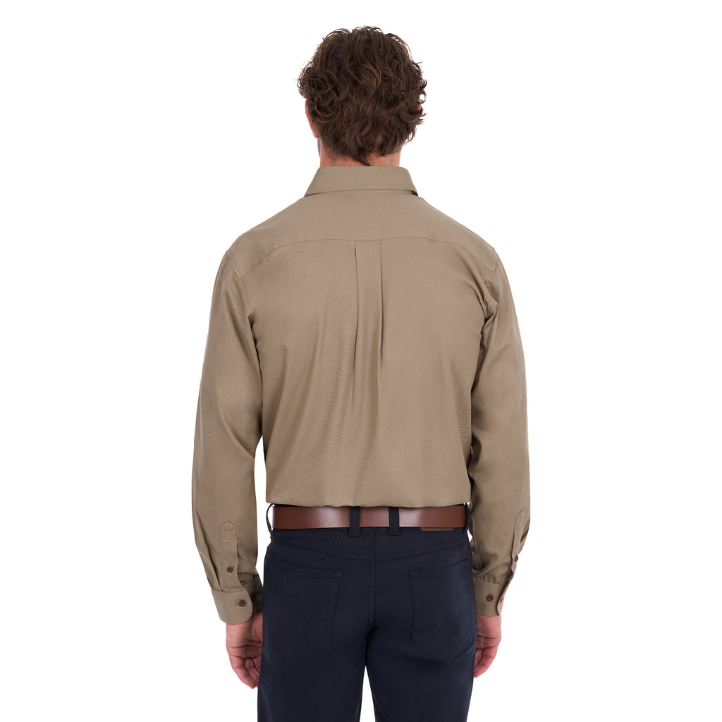 A man viewed from behind, modelling a sand coloured Thomas Cook Heavy Drill Half Button L/S Work Shirt (TCP1120163) paired with navy blue pants and a tan belt, on a white background.