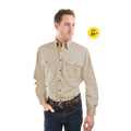 A man modelling a bone Thomas Cook Light Drill Full Button L/S Shirt (TCP1125005) paired with a brown leather belt and denim jeans.