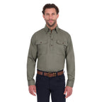 A man modelling a military green Thomas Cook Light Drill Half Button Long Sleeve Work Shirt (TCP1126005) with two chest flap pockets, paired with dark jeans and a brown belt, against a plain white background.