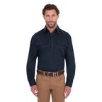 A man modelling a navy blue Thomas Cook Light Drill Half Button Long Sleeve Work Shirt (TCP1126005) with two chest flap pockets, paired with camel coloured jeans and a brown belt, against a plain white background.
