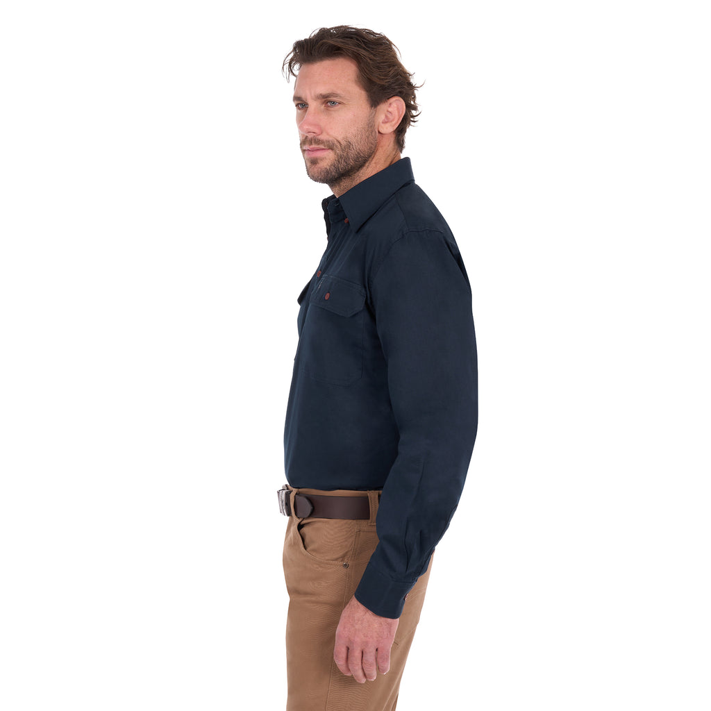 A man in profile modelling a navy blue Thomas Cook Light Drill Half Button Long Sleeve Work Shirt (TCP1126005) with two chest flap pockets, paired with camel coloured jeans and a brown belt, against a plain white background.