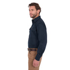 A man in profile modelling a navy blue Thomas Cook Light Drill Half Button Long Sleeve Work Shirt (TCP1126005) with two chest flap pockets, paired with camel coloured jeans and a brown belt, against a plain white background.