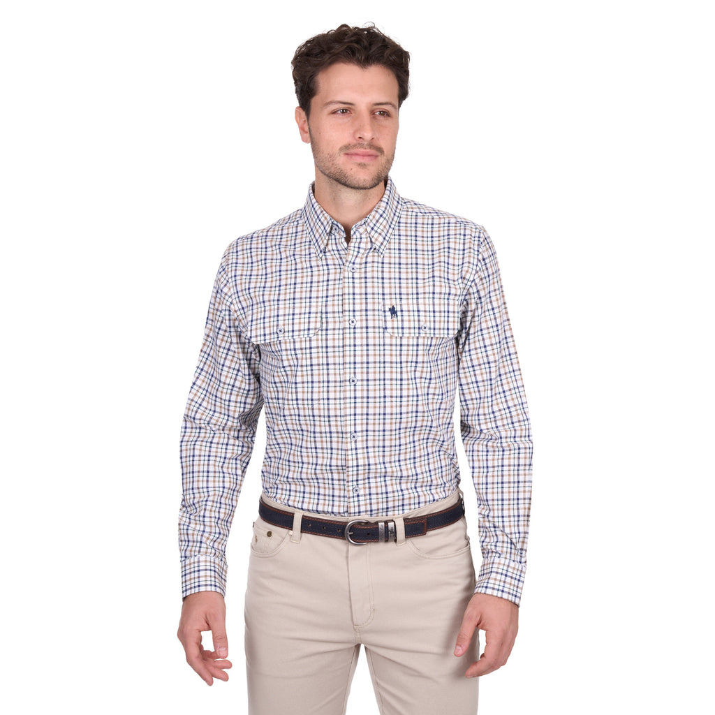 A man stands against a plain white background wearing a Thomas Cook Mens Chad L/S Shirt (T6W1115041) in navy/green, tucked into light beige pants with a belt.