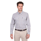 A man stands against a plain white background wearing a Thomas Cook Mens Chad L/S Shirt (T6W1115041) in navy/green, tucked into light beige pants with a belt.