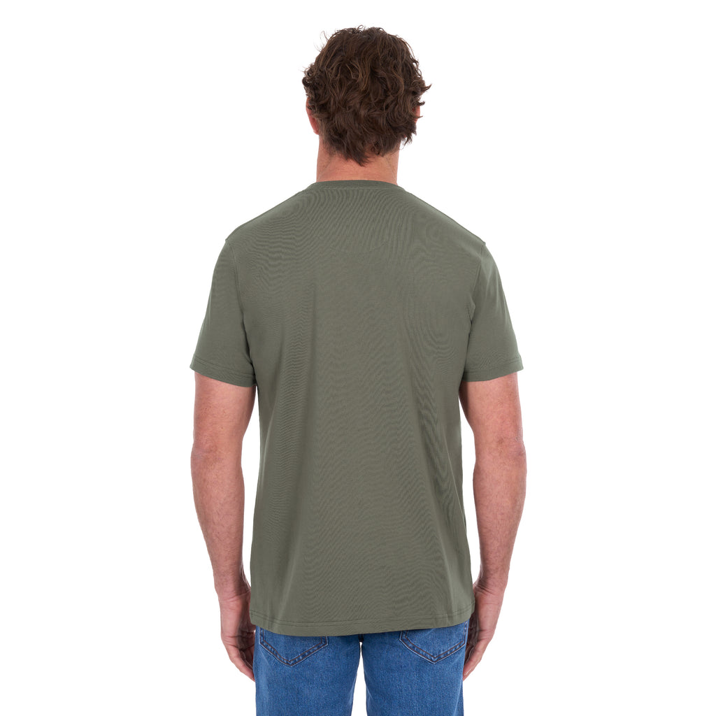 A man from behind, modelling a military green Thomas Cook Men's Classic Fit Short Sleeve Tee (TCP1514051) paired with blue denim jeans on a white background.