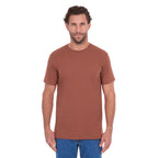 A man modelling a rust Thomas Cook Men's Classic Fit Short Sleeve Tee (TCP1514051) paired with blue denim jeans on a white background.