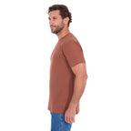 A man in profile modelling a rust Thomas Cook Men's Classic Fit Short Sleeve Tee (TCP1514051) paired with blue denim jeans on a white background.