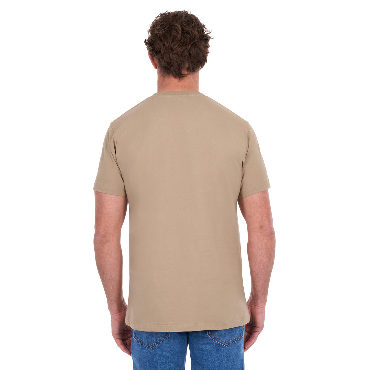 A man from behind modelling a sand Thomas Cook Men's Classic Fit Short Sleeve Tee (TCP1514051) paired with blue denim jeans on a white background.