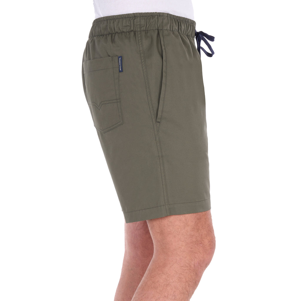 A man modelling a pair of military green Thomas Cook Men's Darcy Shorts (TCP1309037), shown from the side, with a white background.