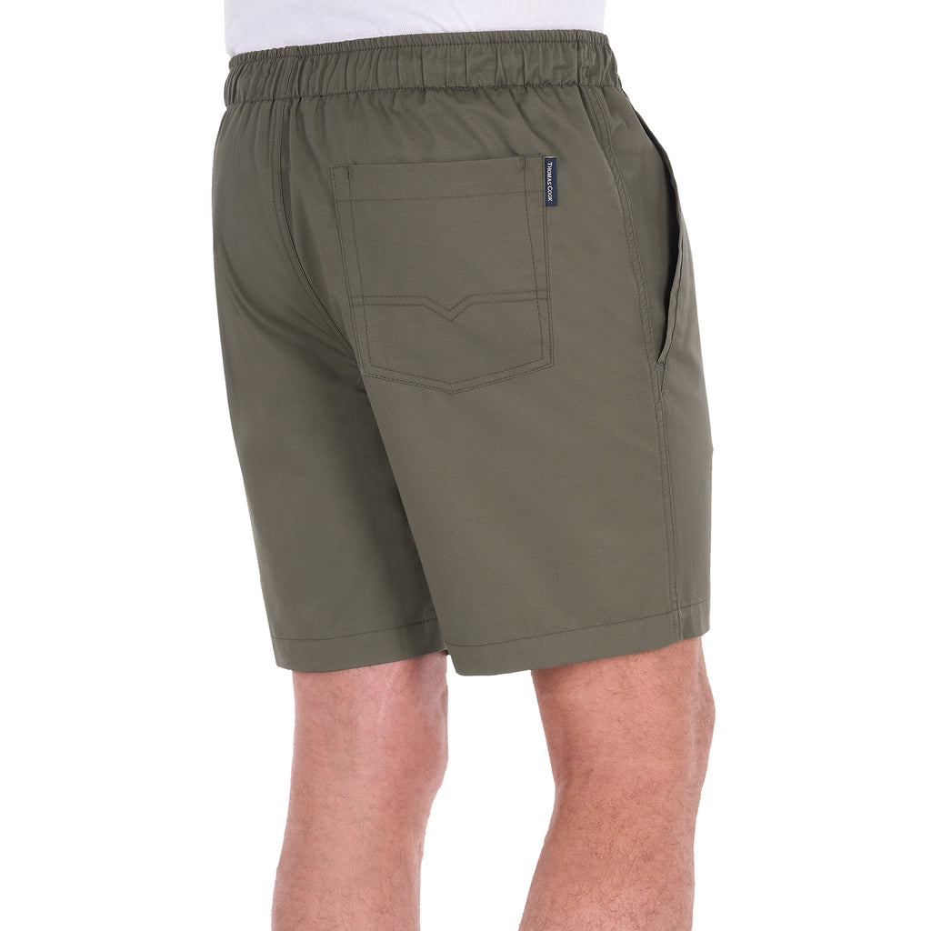 A man modelling a pair of military green Thomas Cook Men's Darcy Shorts (TCP1309037), shown from 3-4 back, with a white background.
