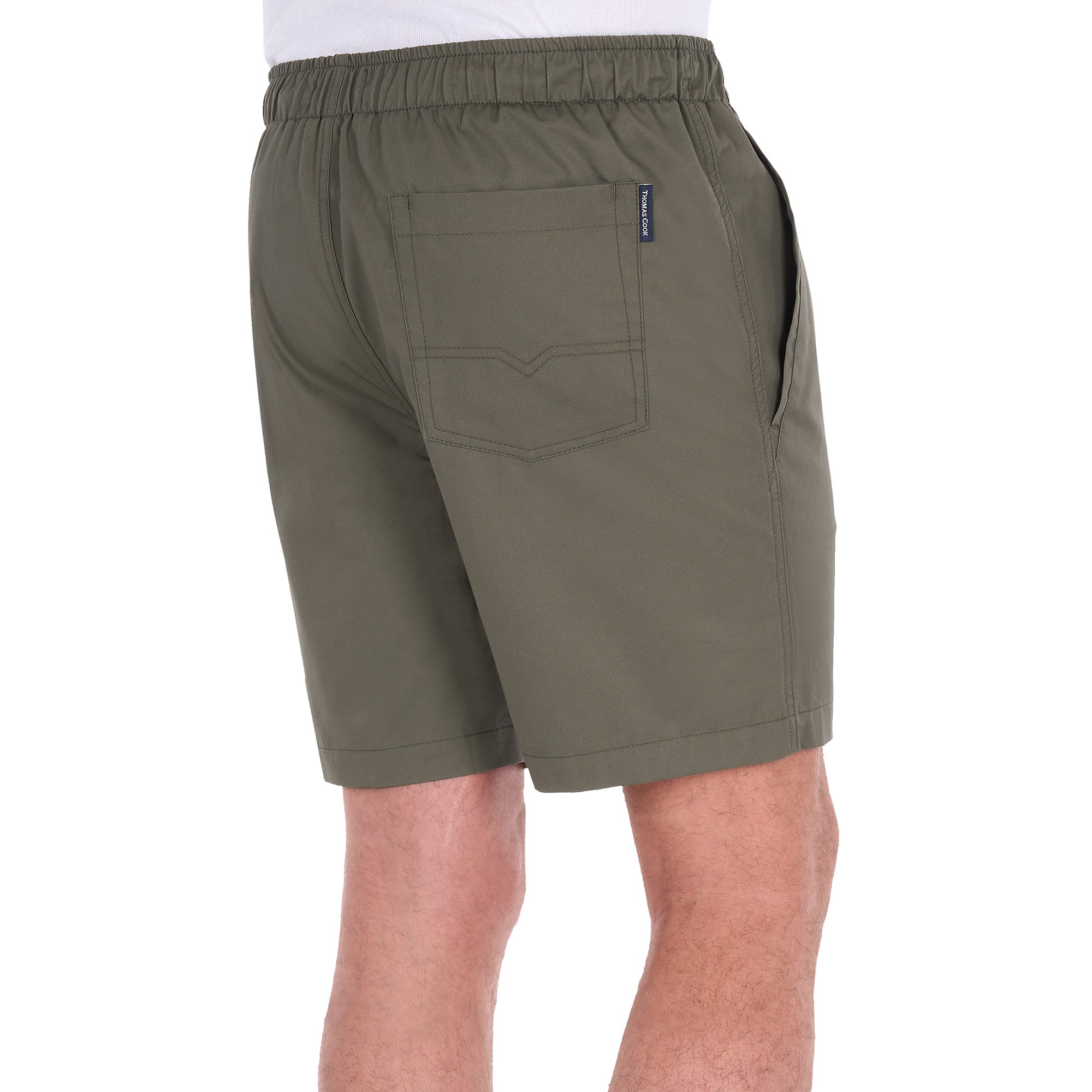 A man modelling a pair of military green Thomas Cook Men's Darcy Shorts (TCP1309037), shown from 3-4 back, with a white background.