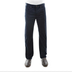A pair of dark navy Thomas Cook Men's Jake Comfort Waist Jeans (TCP1215031) shown on a model from the waist down, paired with a white shirt and dark brown leather boots, against a plain white background.