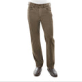 A pair of Thomas Cook Men's Jake Comfort Waist Jeans (TCP1215031) in a mulch colour, shown on a model from the waist down wearing a white shirt and dark brown leather shoes against a white background.