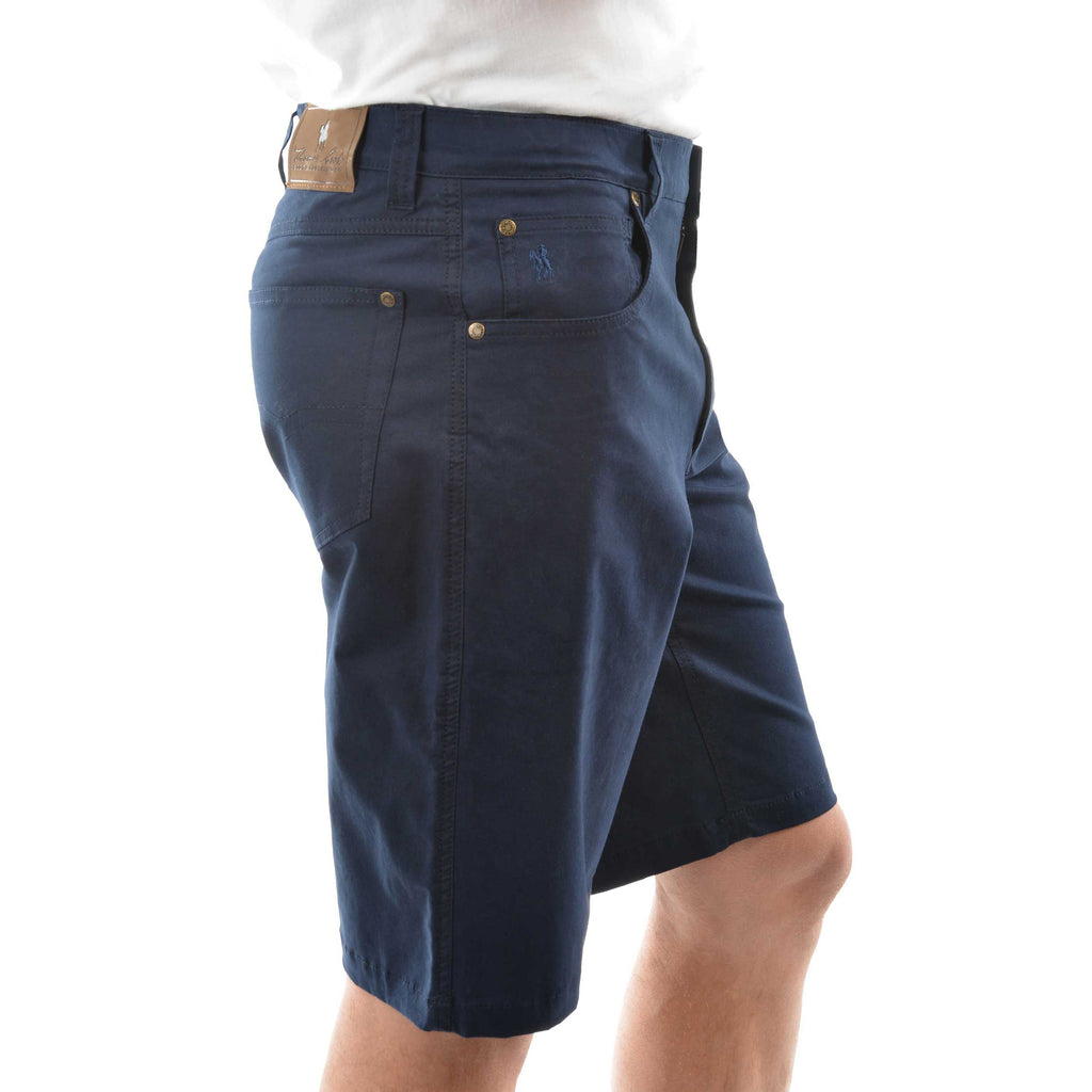 A man in profile wearing dark navy blue Thomas Cook Men's Jake Comfort Waist Shorts (TCP1307031) with a white shirt partially visible at the top, photographed against a plain white studio background.