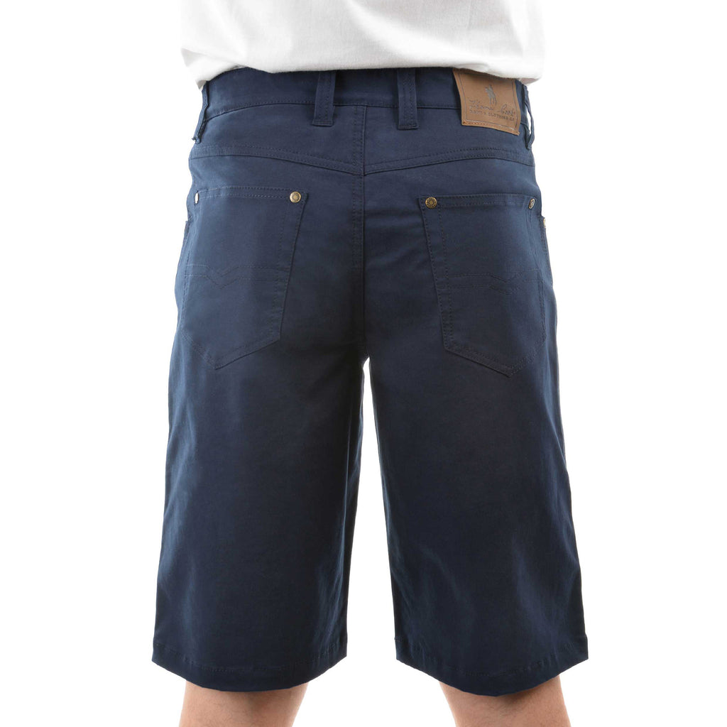 A man viewed from behind wearing dark navy blue Thomas Cook Men's Jake Comfort Waist Shorts (TCP1307031) with a white shirt partially visible at the top, photographed against a plain white studio background.