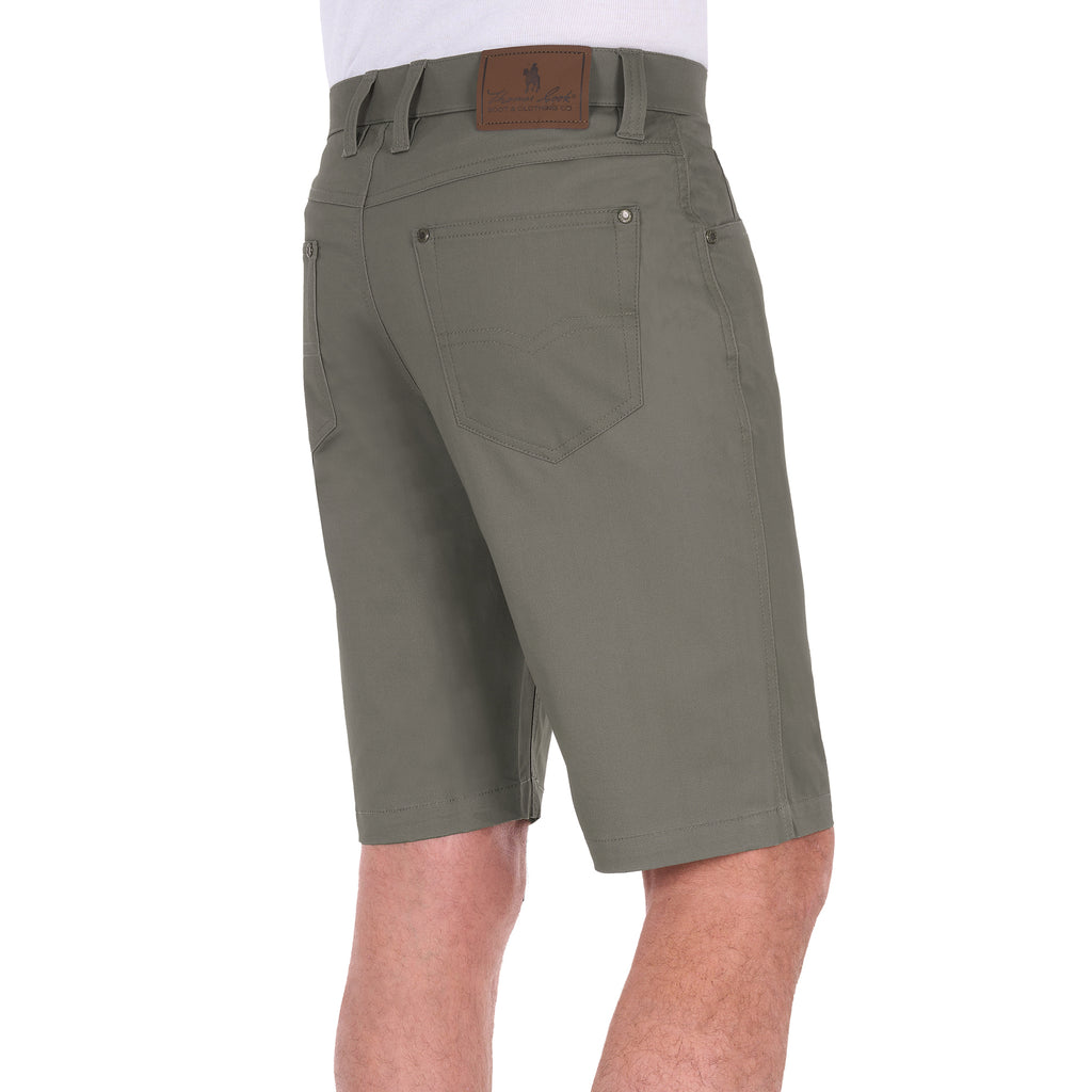 A 3-4 back view of a man wearing stone Thomas Cook Men's Jake Comfort Waist Shorts (TCP1307031) with a white shirt partially visible at the top, photographed against a plain white studio background.