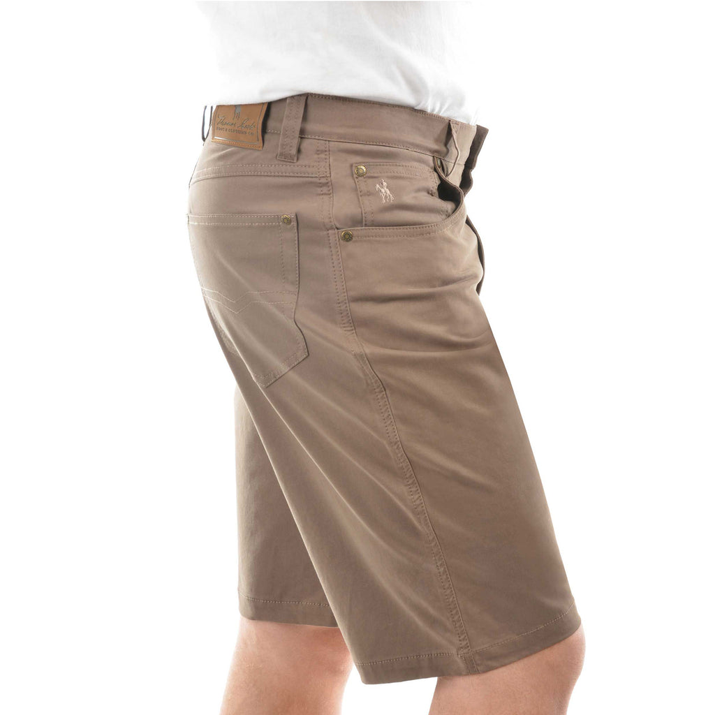 A man in profile wearing mulch coloured  Thomas Cook Men's Jake Comfort Waist Shorts (TCP1307031) with a white shirt partially visible at the top, photographed against a plain white studio background.