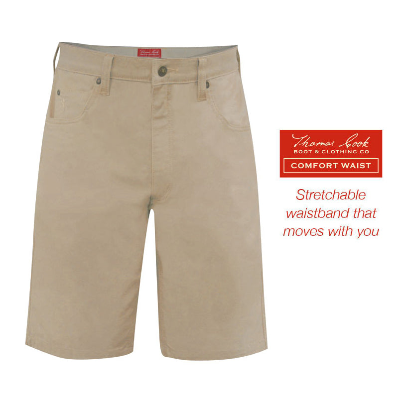 A pair of stone Thomas Cook Men's Jake Comfort Waist Shorts (TCP1307031) in flat lay with a branded label on the right side that reads 'Thomas Cook Boot & Clothing Co. Comfort Waist Stretchable waistband that moves with you'.